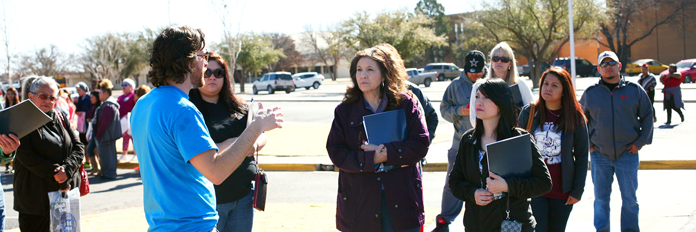 A man gives a speech on campus